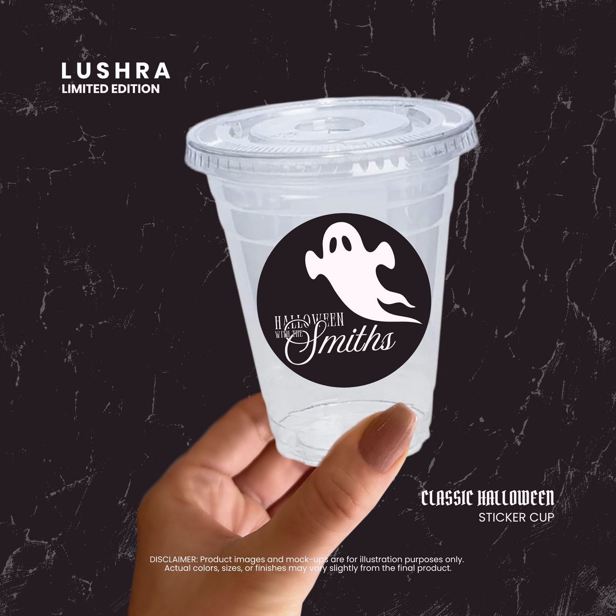 Clear plastic cup with a Halloween-themed sticker held by a hand on a black background