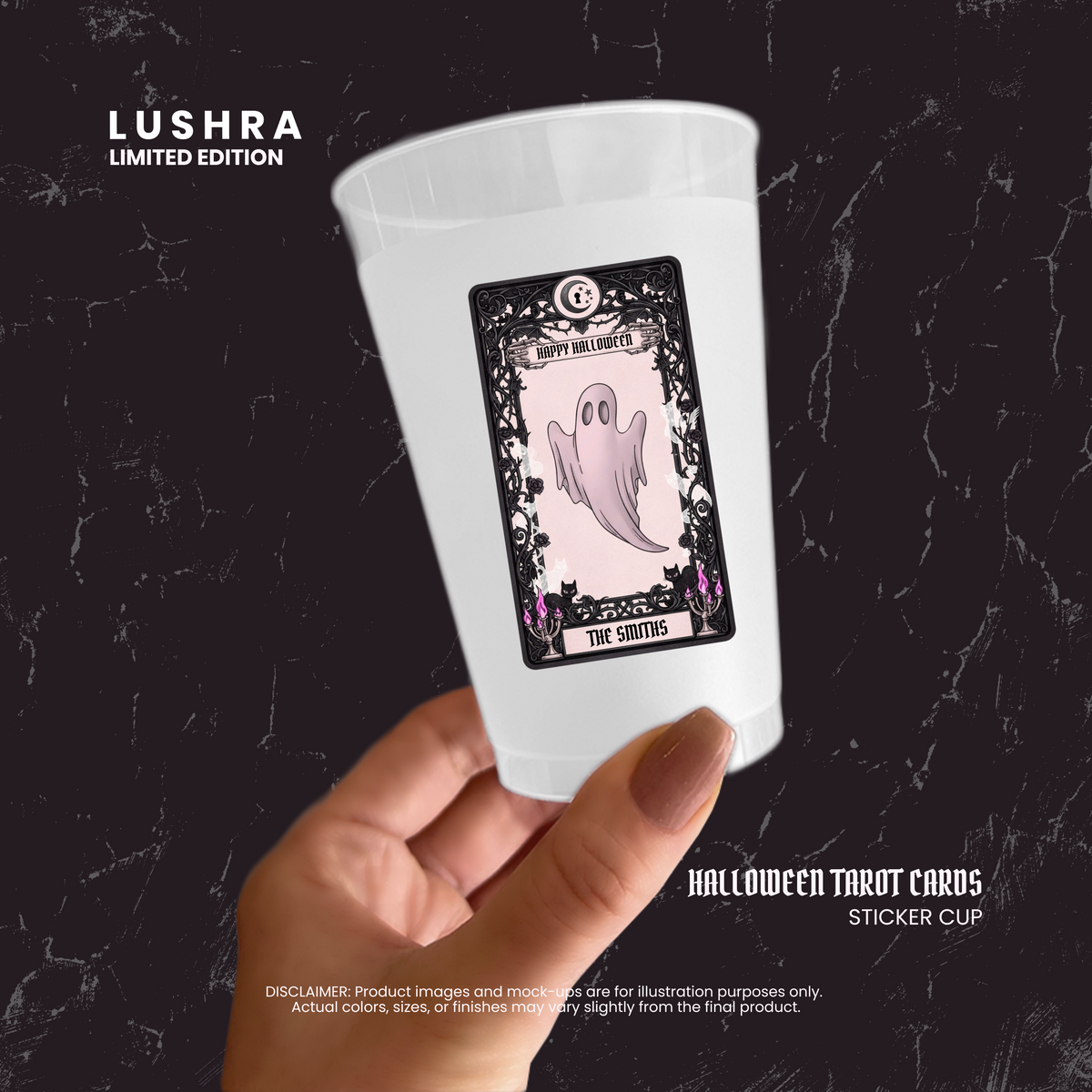 White cup with Halloween-themed sticker featuring a ghost and text, held by a hand against a dark background.