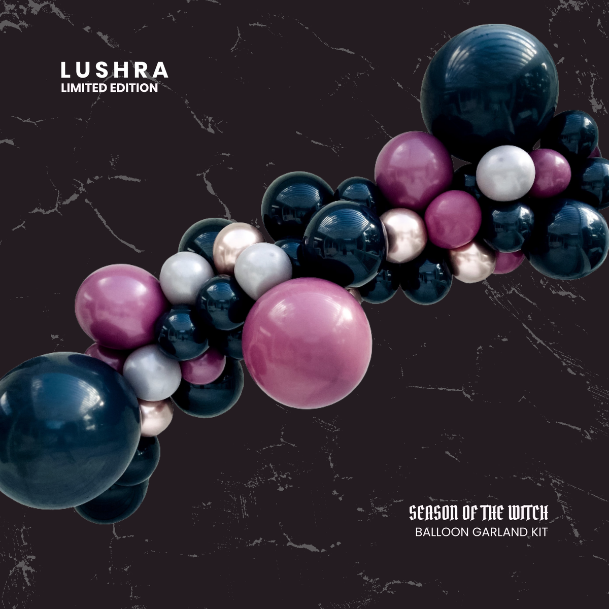 Lushra balloon garland kit with pink, blue, and silver balloons on a dark background
