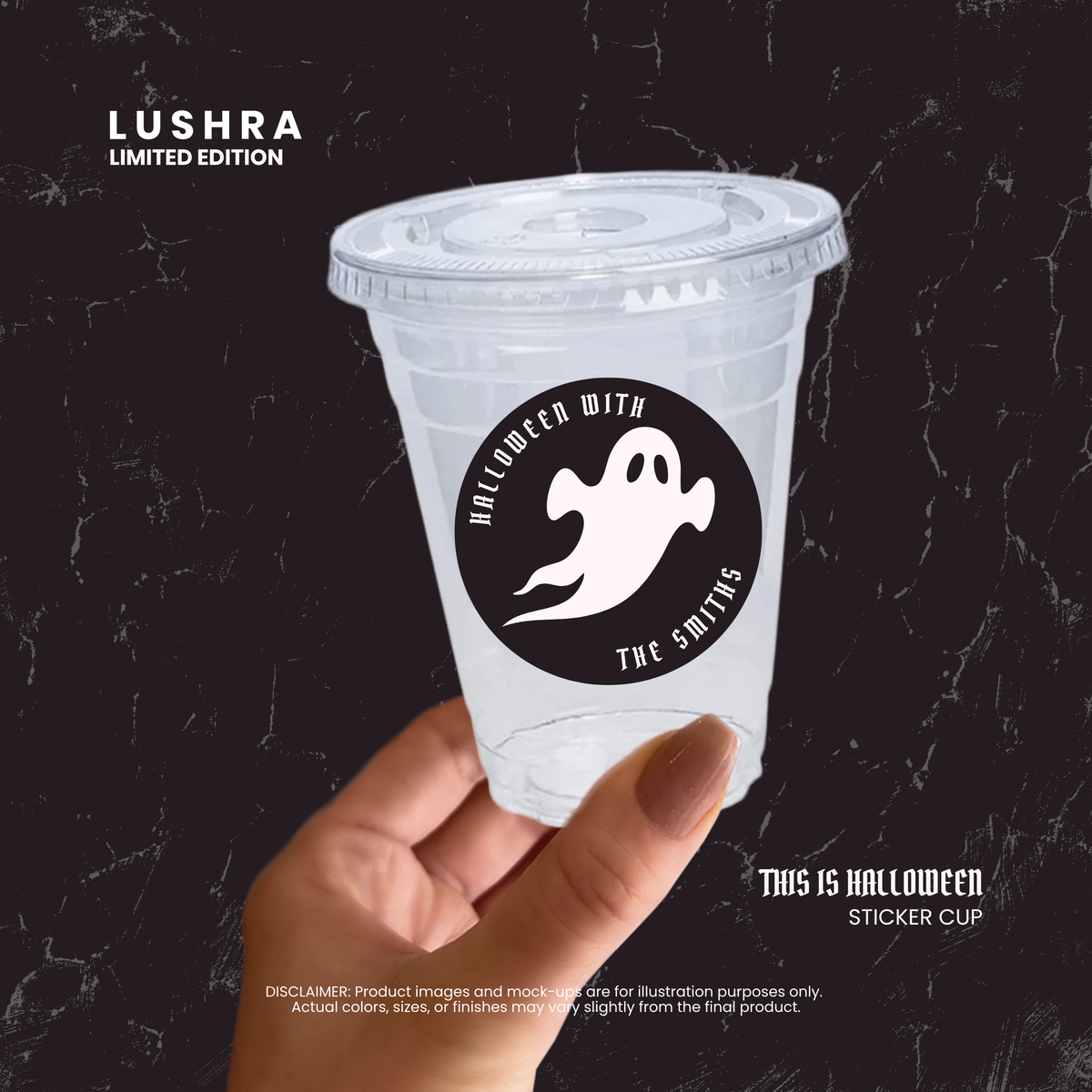 Clear plastic cup with Halloween-themed sticker held by a hand against a dark background